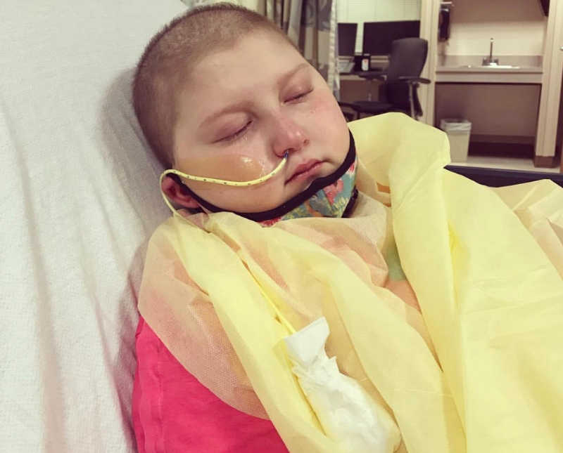 Intubated girl with leukemia lays in ICU