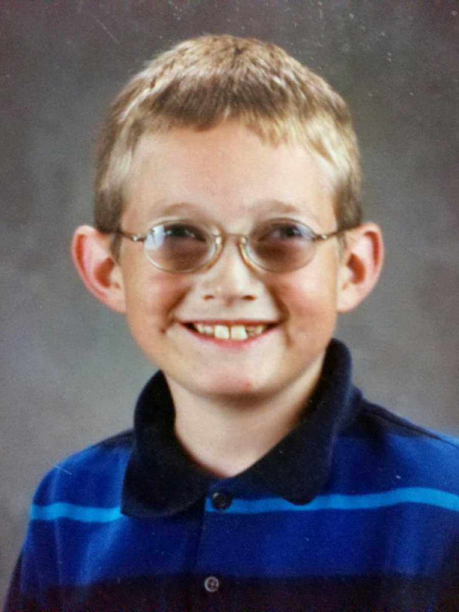 Little boy who was bullied in school smiles for school picture