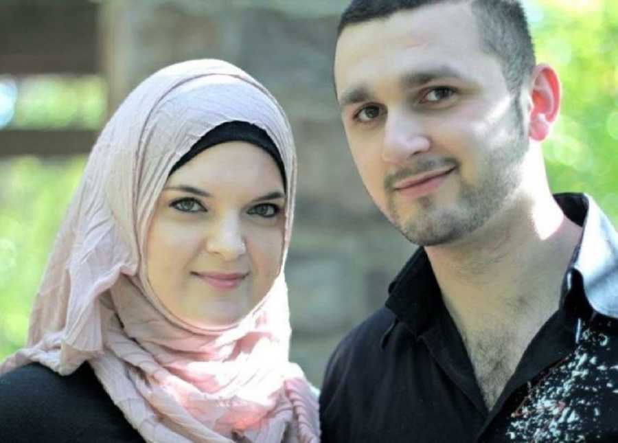 Woman who converted to Islam smiles beside boyfriend