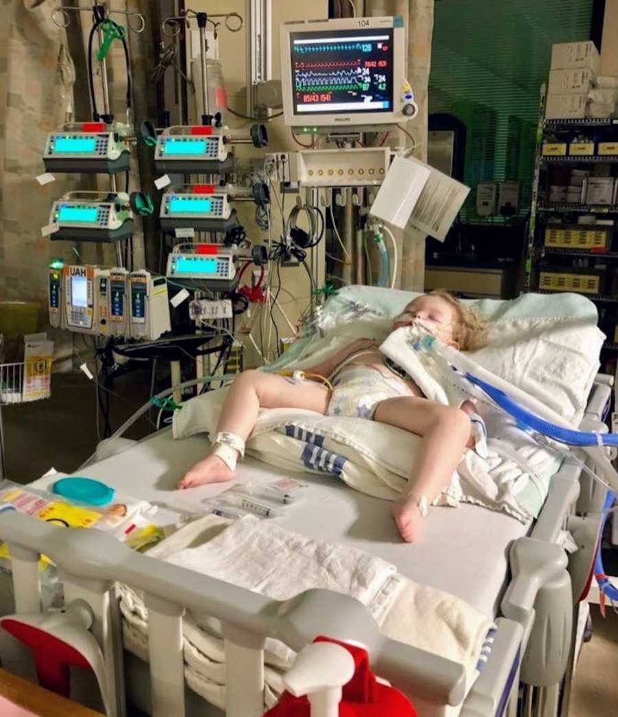 Intubated baby girl whose doctors say she is a "medical mystery" lays asleep in hospital bed