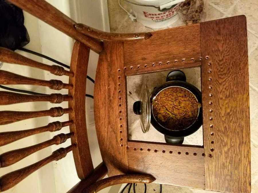 Pot of Thai herbal tea under chair for woman who has miscarriage