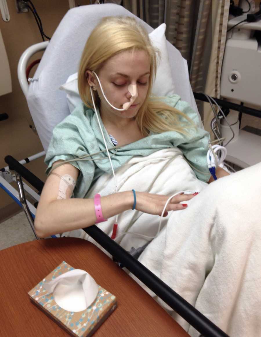 Intubated young woman with gastroparesis sits in hospital bed before having feeding tube placed