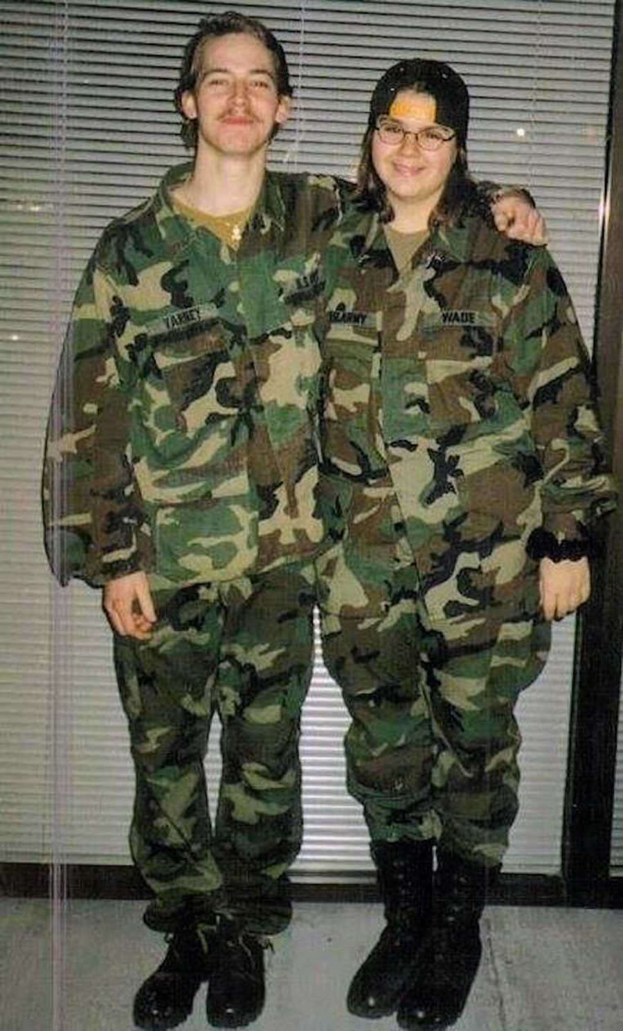 Young woman stands in uniform beside the love of her life who was also in uniform before he passed