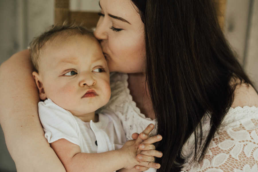 Mother kisses and holds son with Hypoplastic Left Heart Syndrome