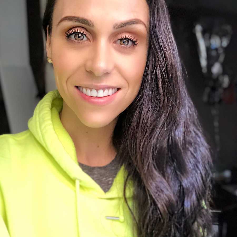 Woman who overcame drug and alcohol addictions smiles in selfie