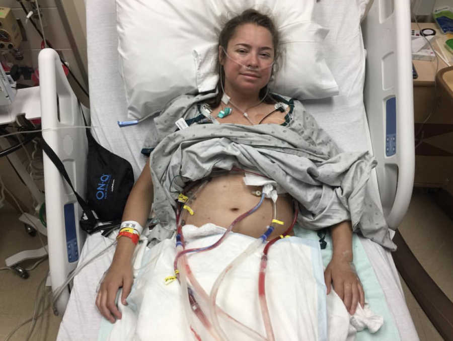 Woman with Cystic Fibrosis lays in hospital bed after having lung transplant