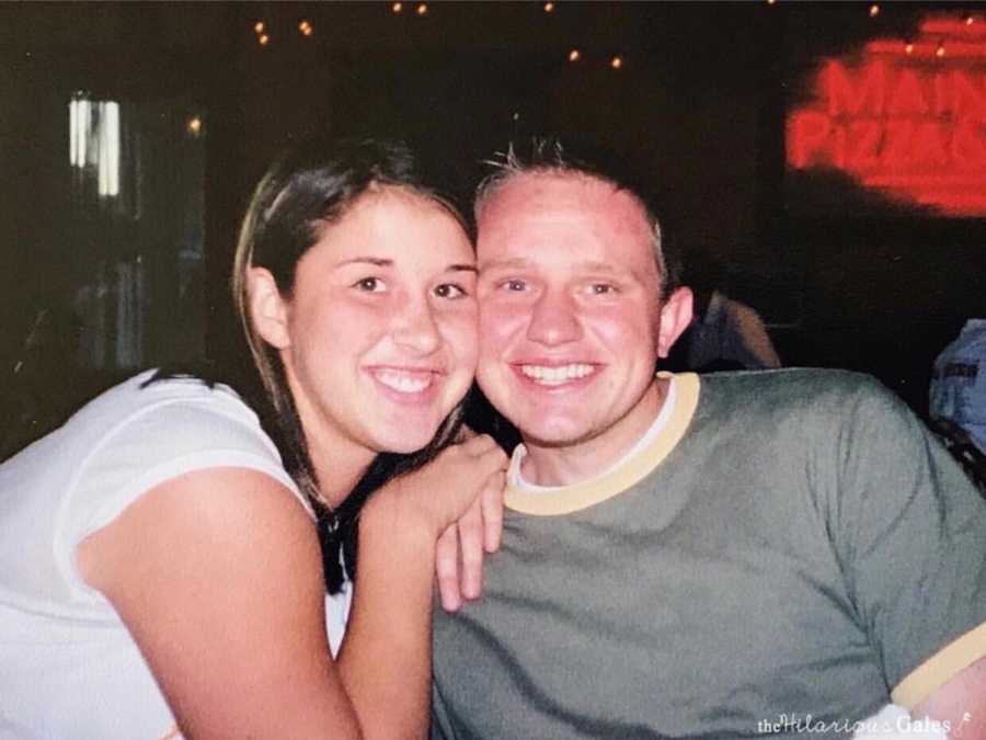 Husband and wife sit smiling at table before they were married