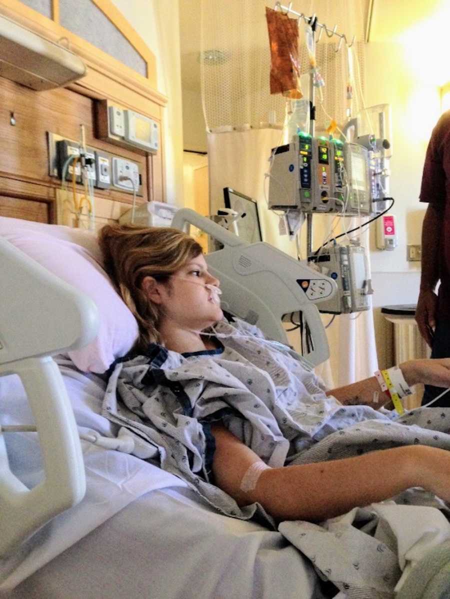 Woman with Crohn's and perenial disease lays in hospital bed on oxygen after surgery