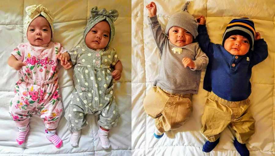 Two baby girls lay on back beside their two quadruplet brothers