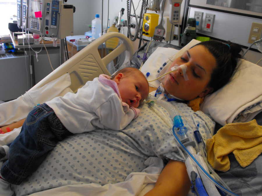 Intubated woman with Guillain-Barre syndrome lays in hospital bed with her baby laying on her chest