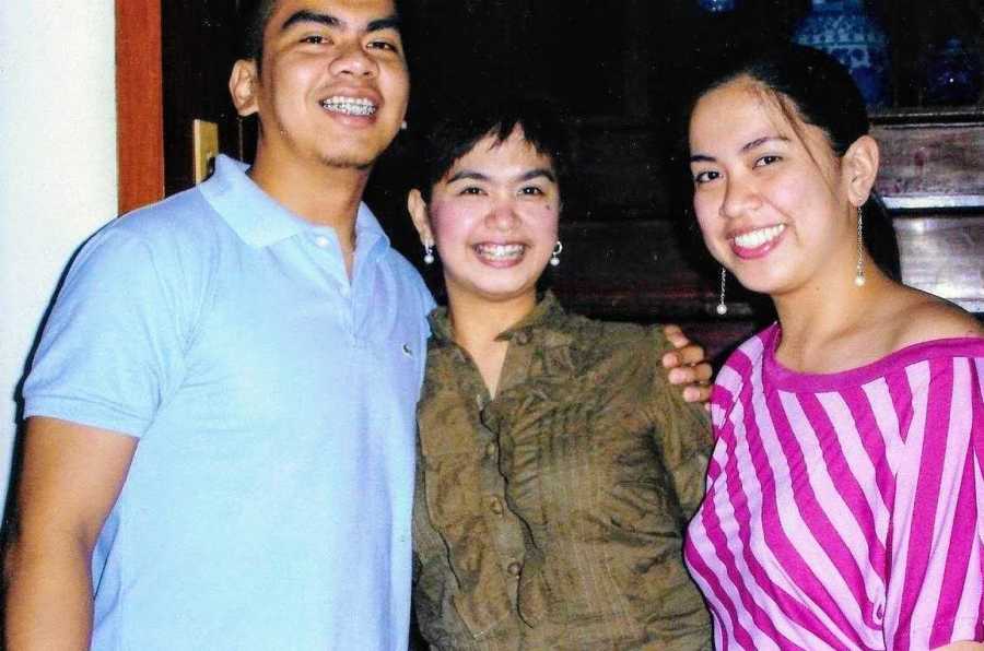 Woman smiles beside her mother and sister