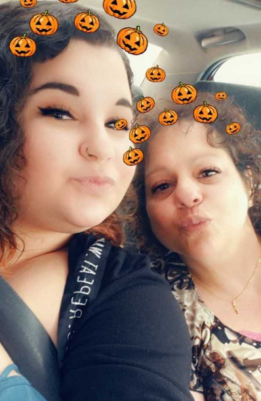 Woman with OCD purses lips in selfie with mother with pumpkin filter 