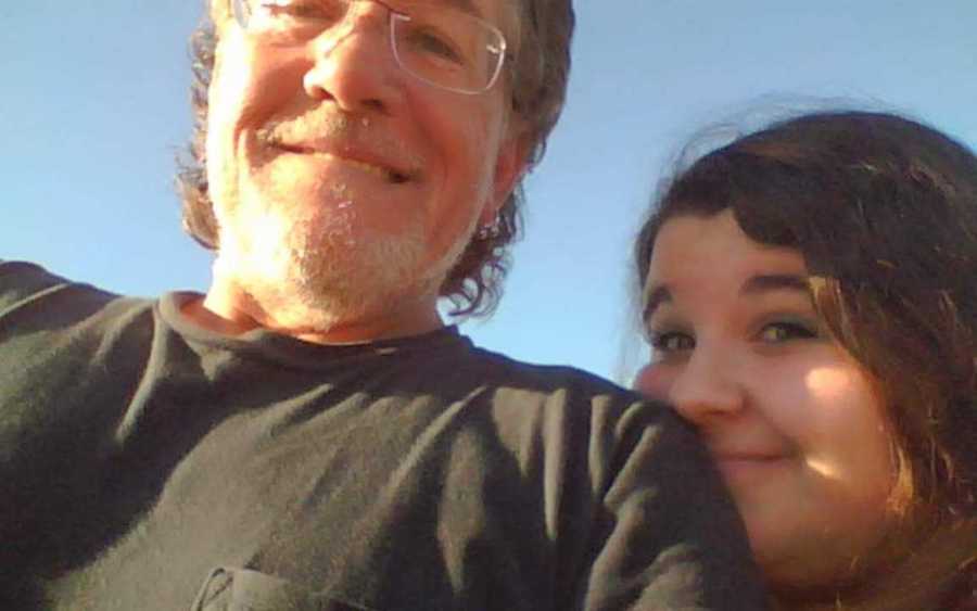 Woman with OCD smiles in selfie with her father