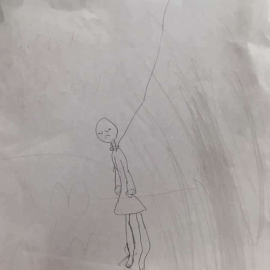Pencil drawing on piece of paper of person hanging themselves