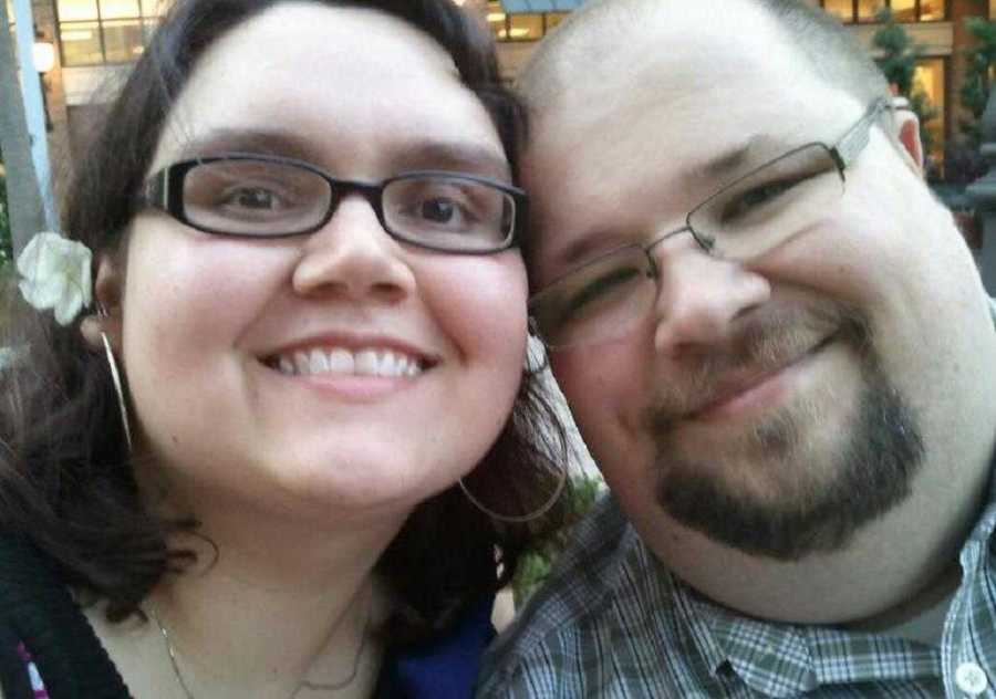 Woman smiles in selfie with her boyfriend she met on dating website