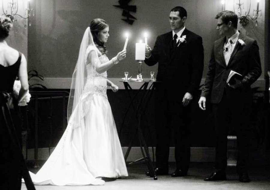 Bride with body dysmorphia stands at altar as she and groom light candle