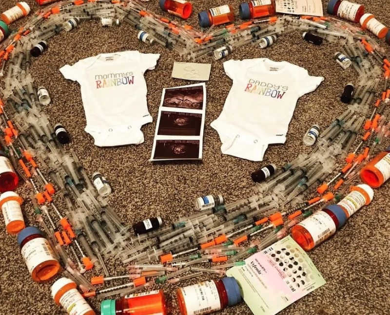 Two onesies and ultrasound pictures surrounded by IVF treatments in shape of heart