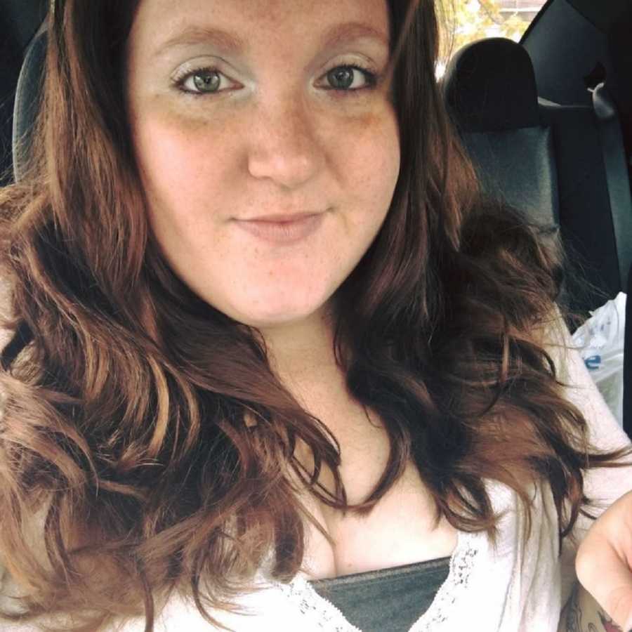 Woman who was sexually abused by father smiles as she takes selfie in car