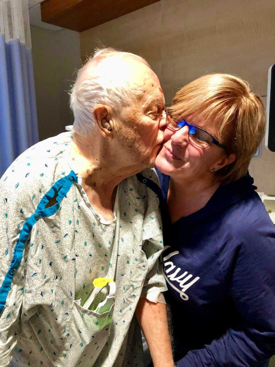 Elderly man in hospital after surgery kisses daughter on the cheek