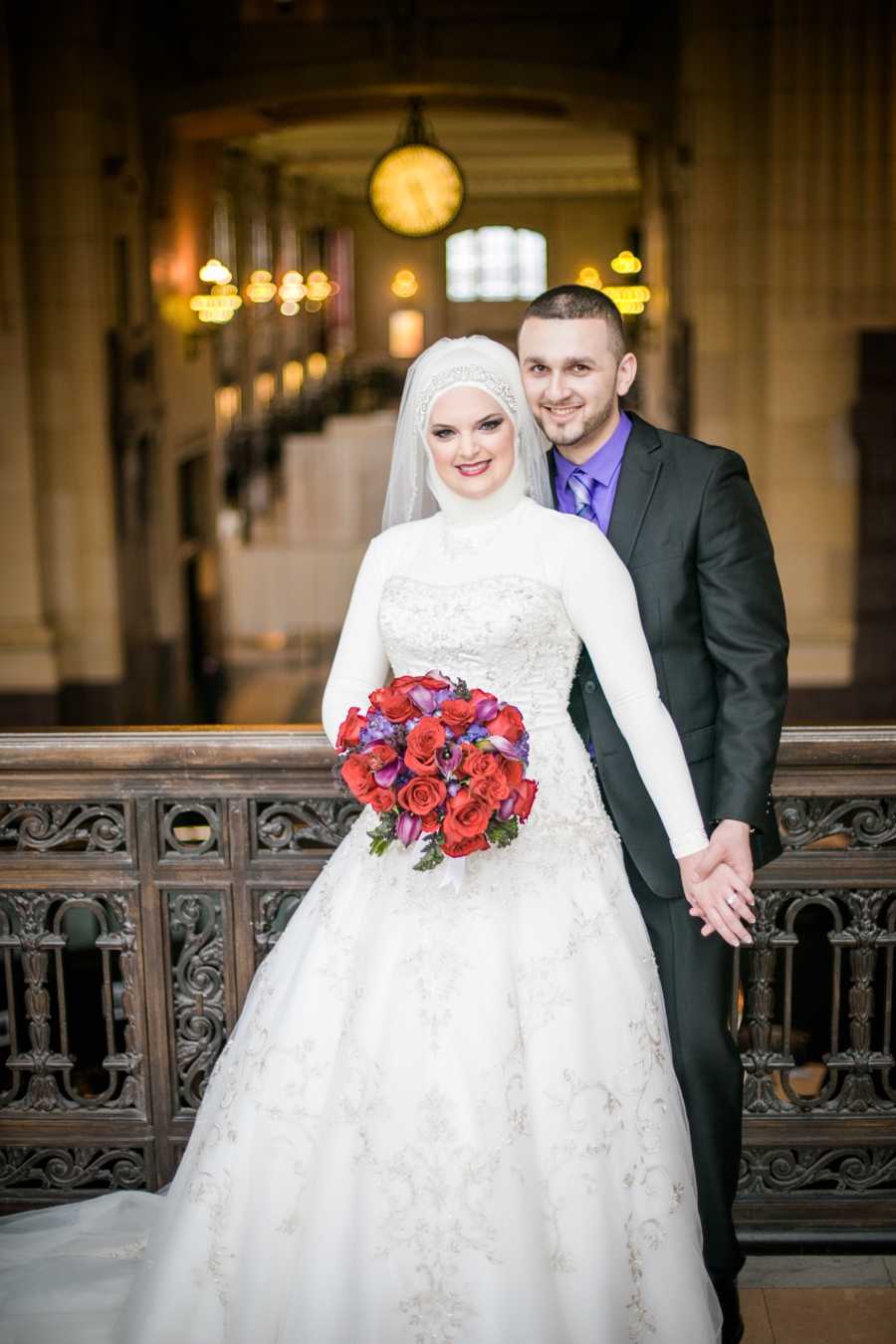 Bride who converted to Islam stands beside groom 