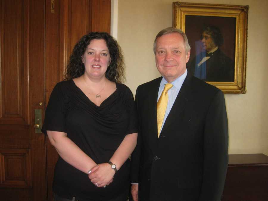 Woman stands beside senator who she wants to ban energy drinks