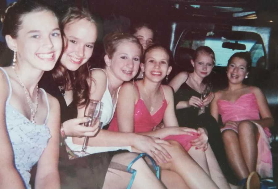 Teen with POTS sits in limo with friends who are all wearing dresses