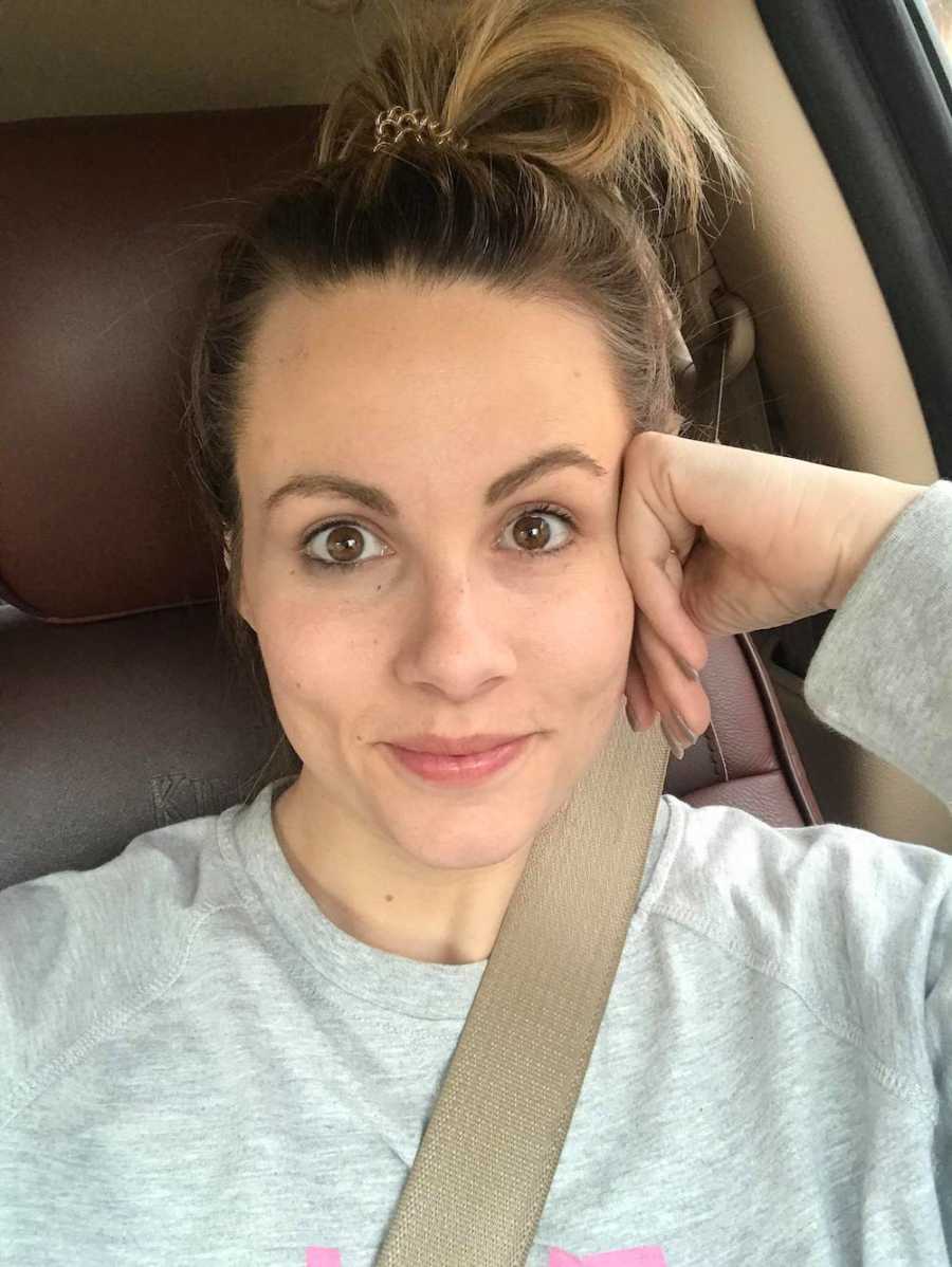 Mother who was struggling with depression smiles as she takes selfie in car