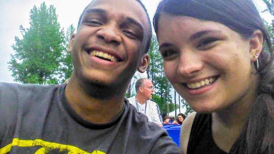 Mixed race couple smiles in selfie