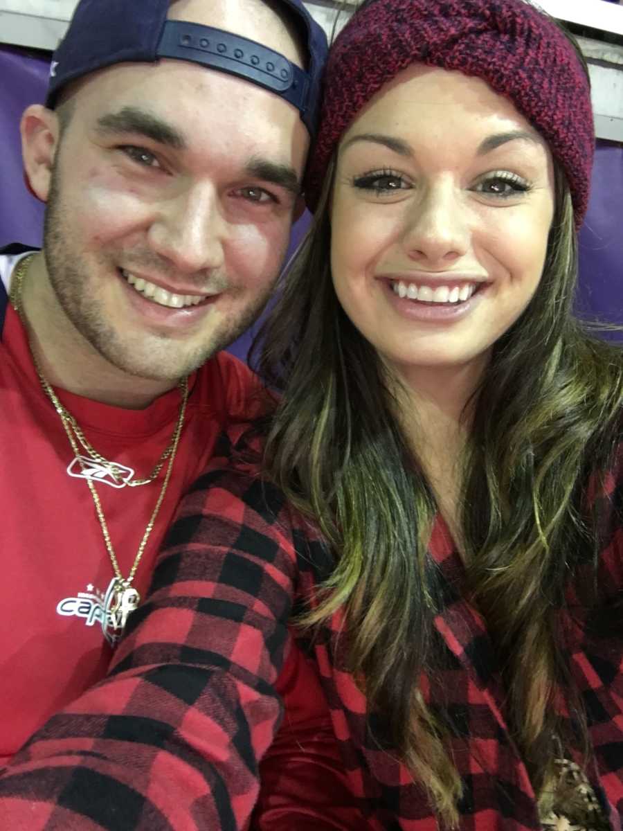 Pregnant woman smiles in selfie with her husband