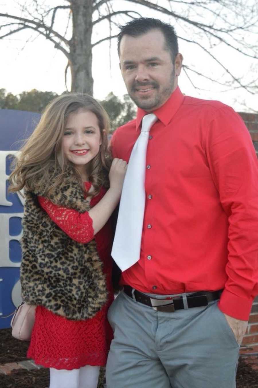 Man who died from heart attack stands smiling outside with daughter for daddy daughter dance