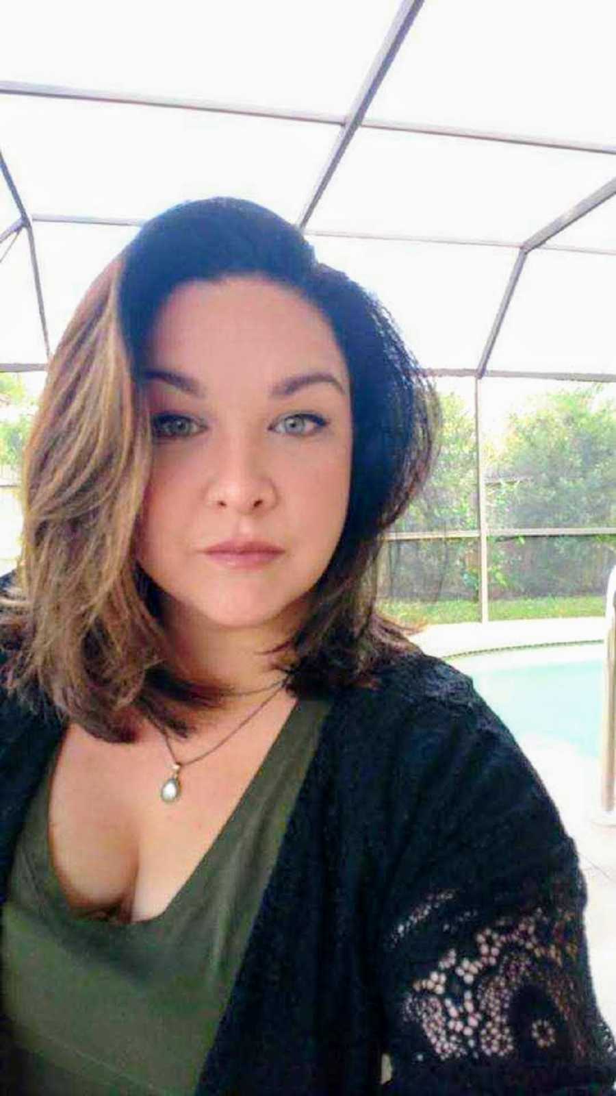 Woman who has struggled with her weight takes selfie in front of pool at home