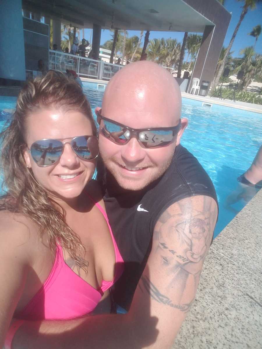 Woman who has always wanted to be pregnant smiles in selfie with husband in pool