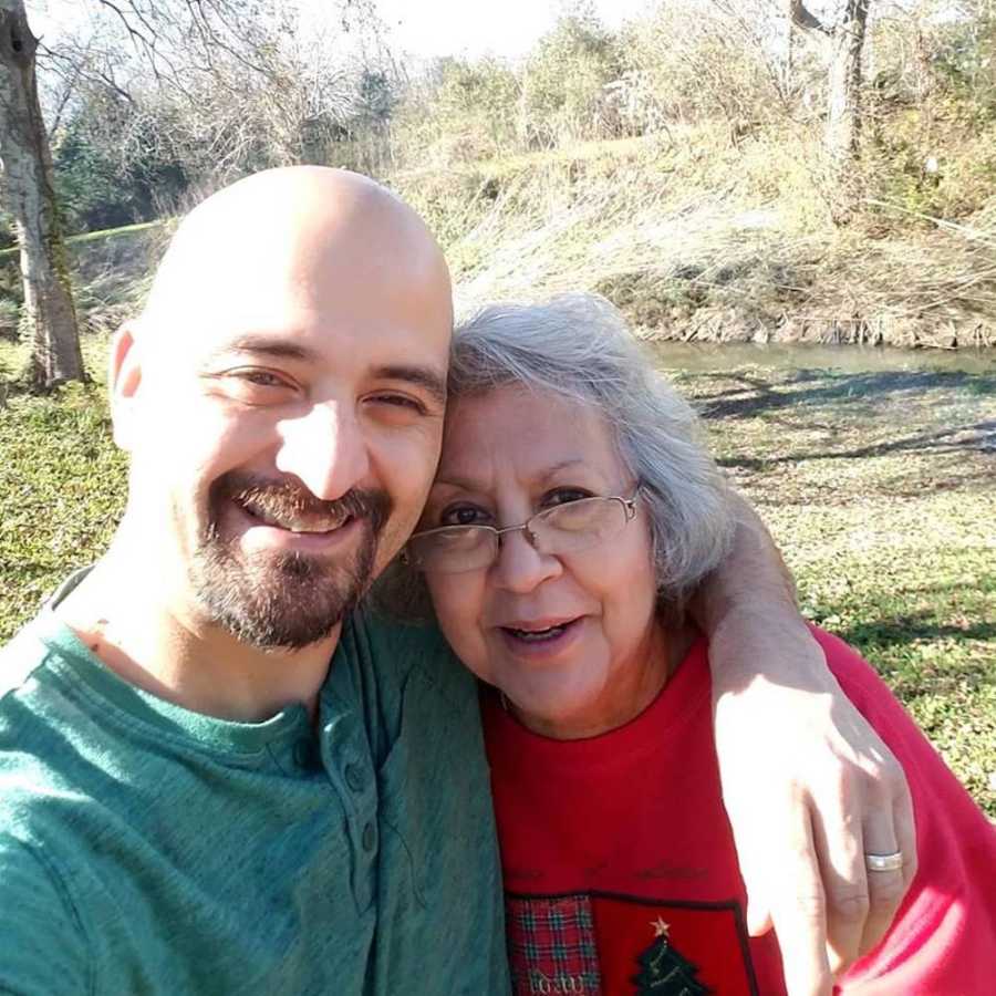 man and mom smiling outside