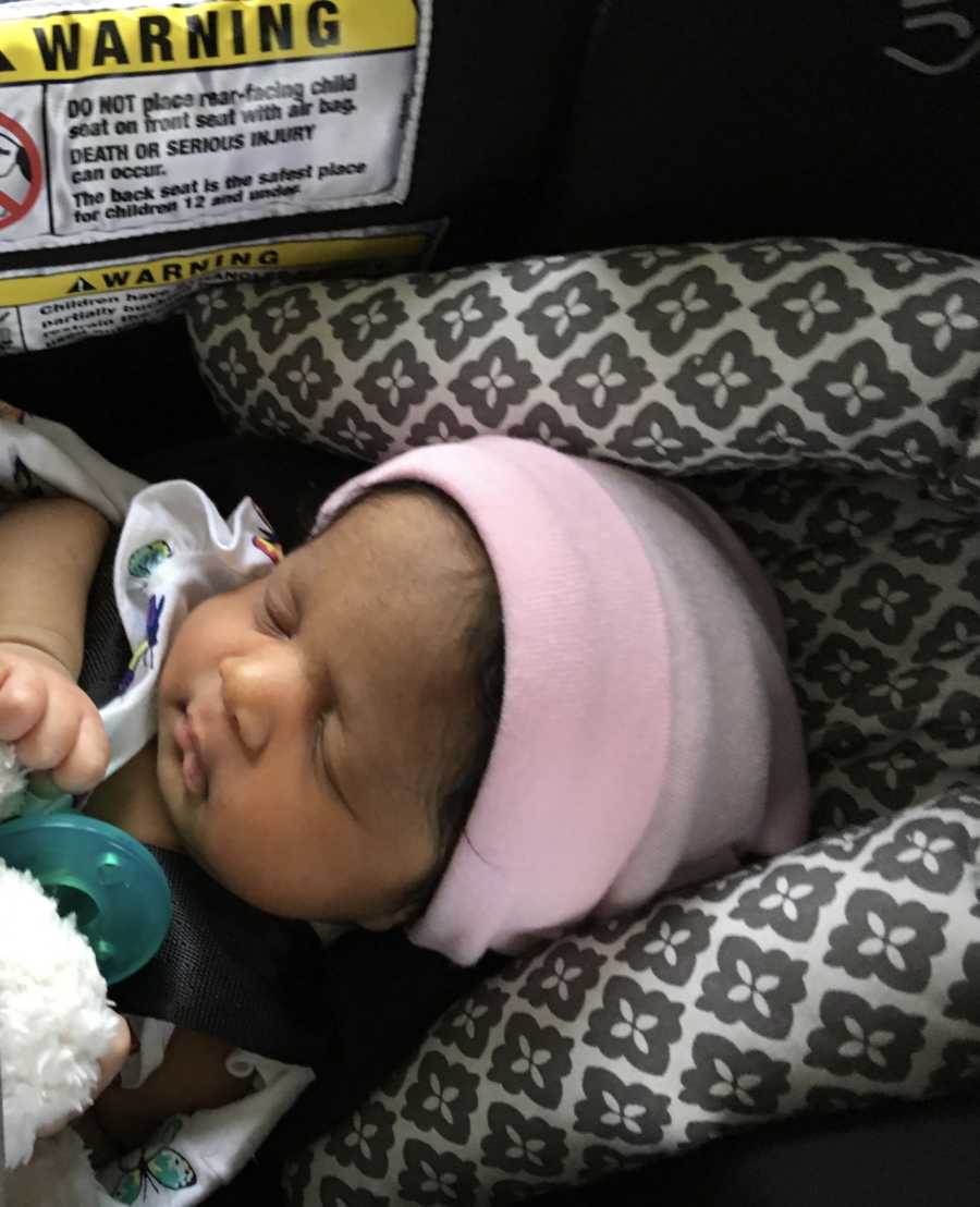 Baby girl whose mother spent 22 days in ICU lays asleep in car seat