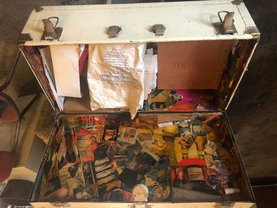 Old trunk opened with random memorabilia 