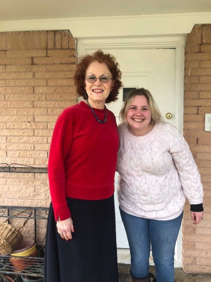 Woman who found old trunk in her attic smiles beside older woman who the trunk belonged to