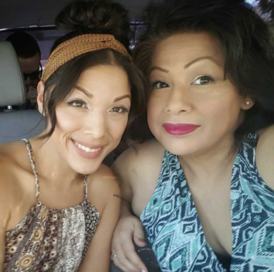 Mom and daughter, made up and smiling in car