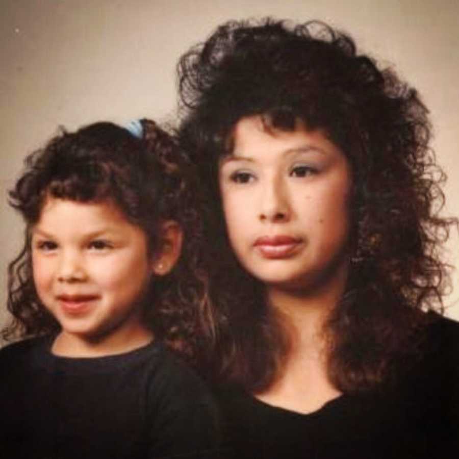 mom and daughter in the 1980s smiling for posed picture