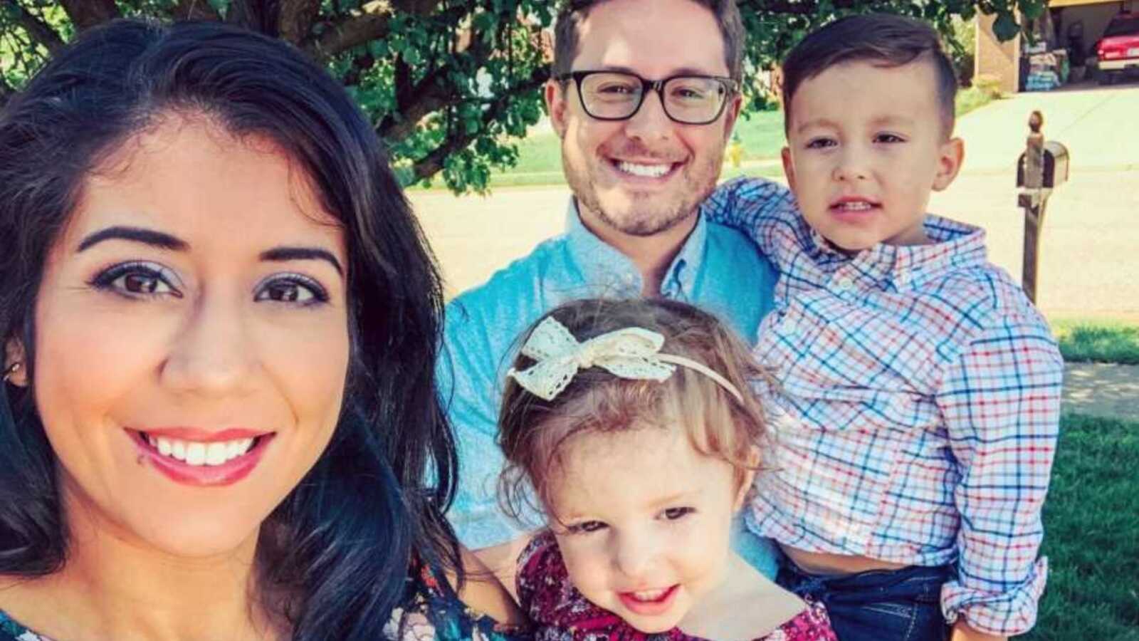 Family of four take a selfie together before Sunday church
