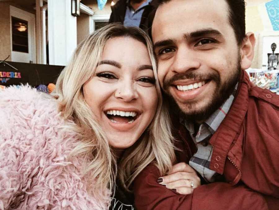 Boyfriend and girlfriend smiling in selfie