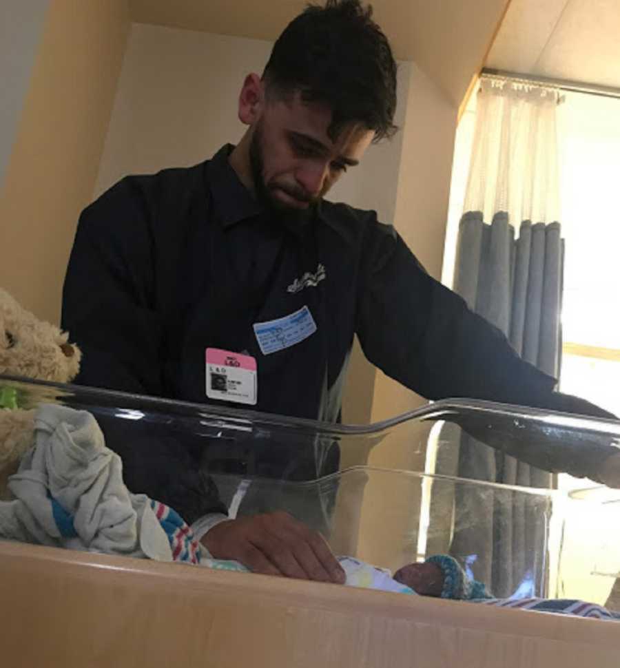 Crying dad embrace stillborn baby in hospital