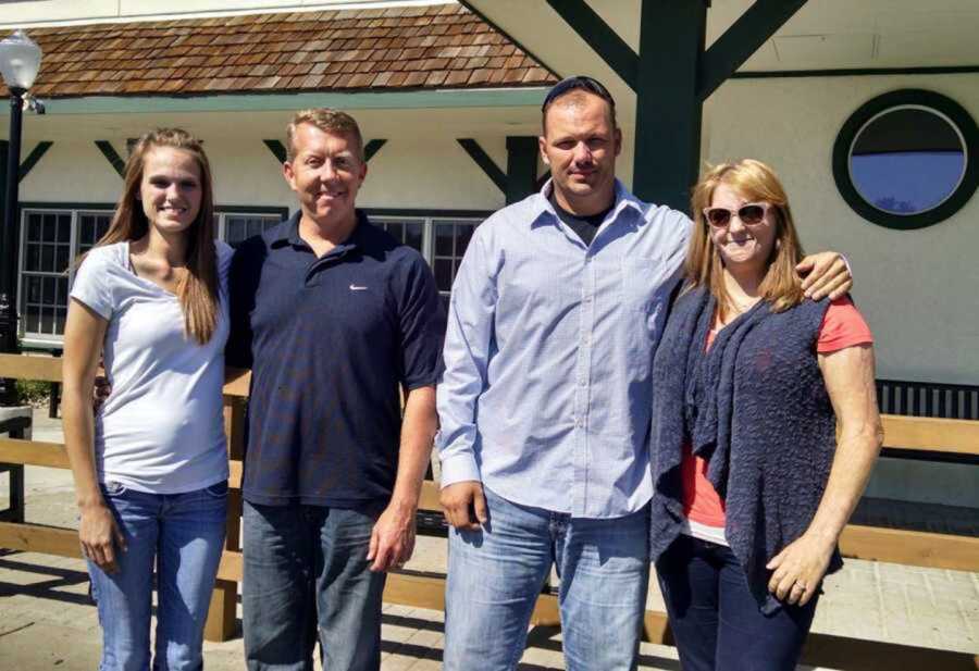 House fire victims pose next to first responders