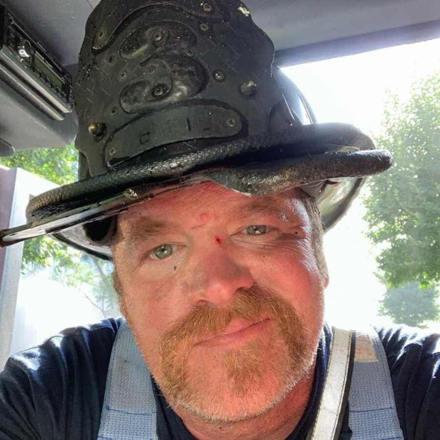 Firefighter wearing fire safety hat