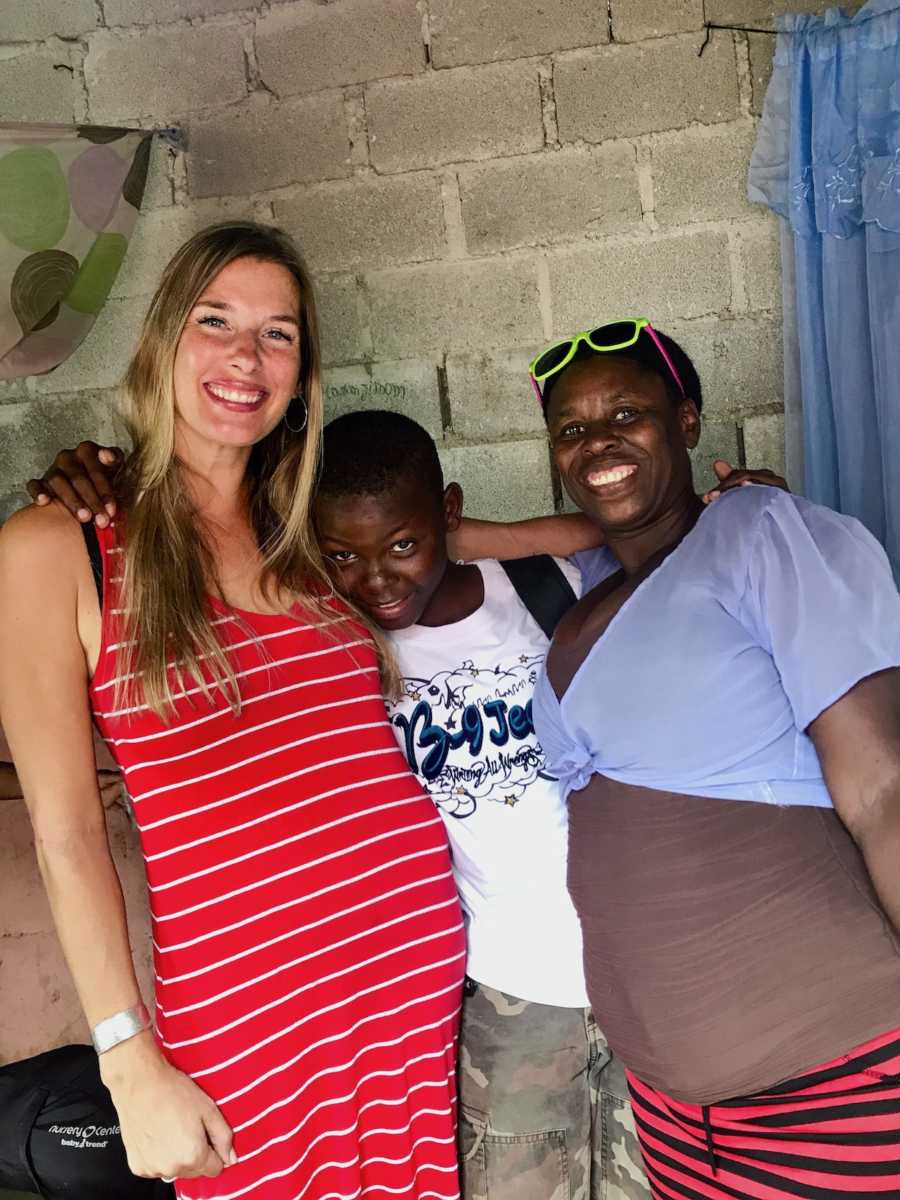 Birth mom and adoptive mom hugging boy