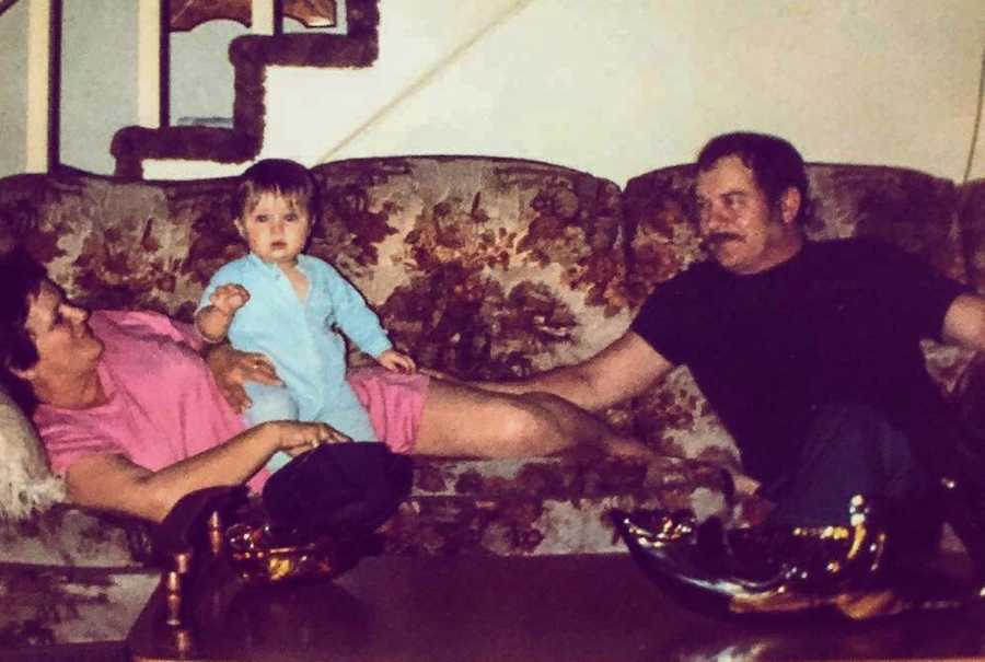 little girl raised by grandparents sitting on grandma's lap