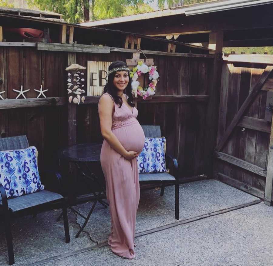 woman posing for a photo during late pregnancy