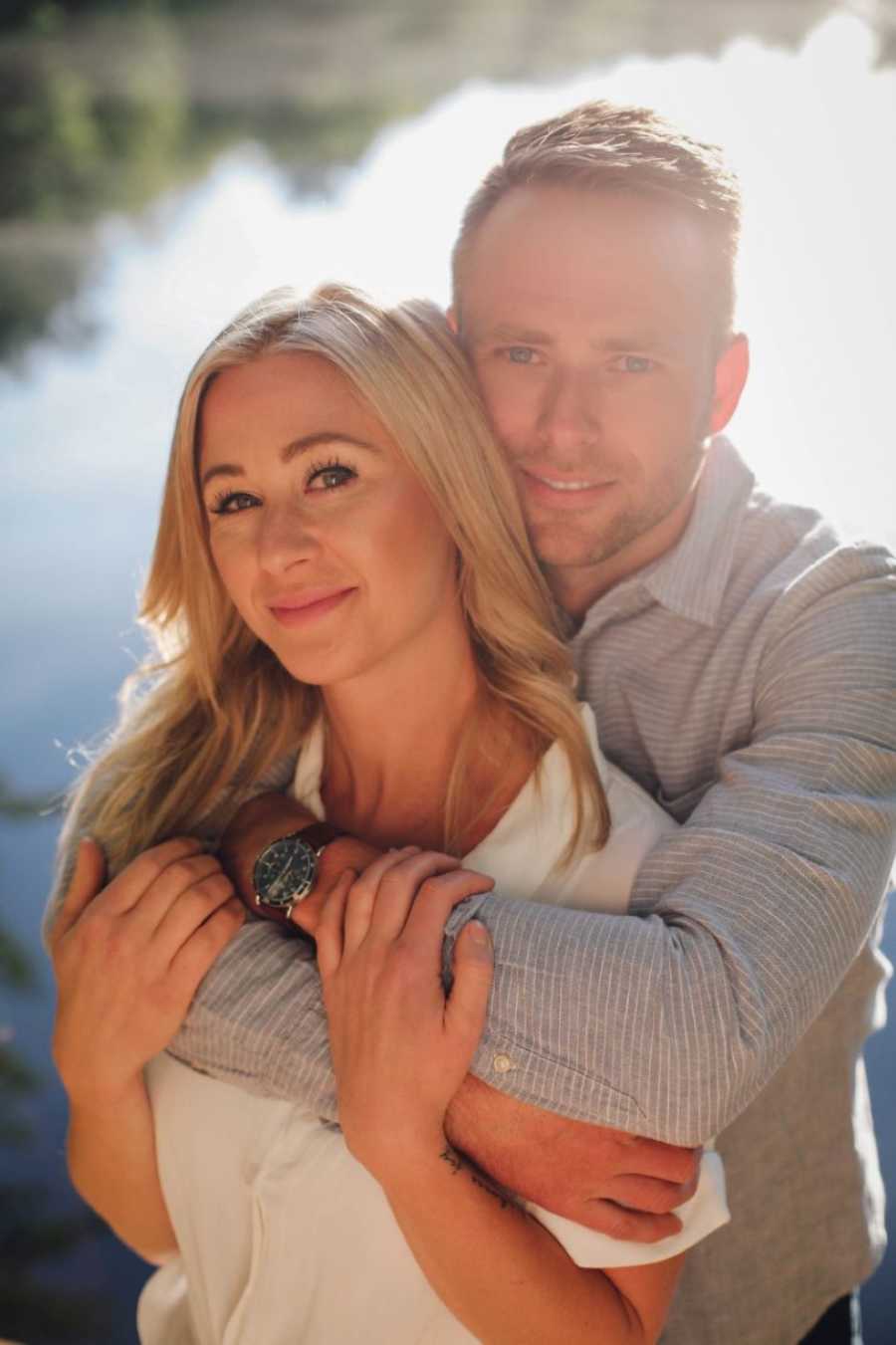 Widow hugs her new husband during an engagement photoshoot