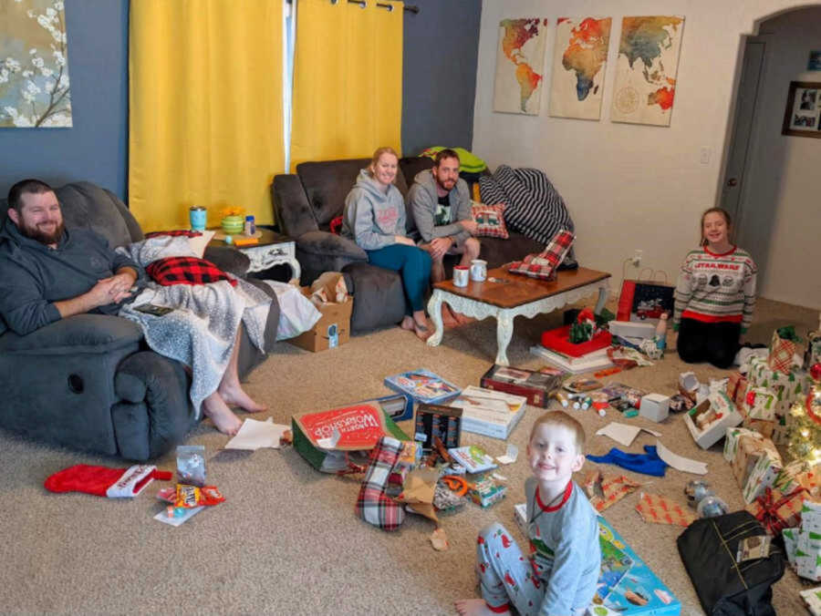 Blended family opening presents on Christmas morning