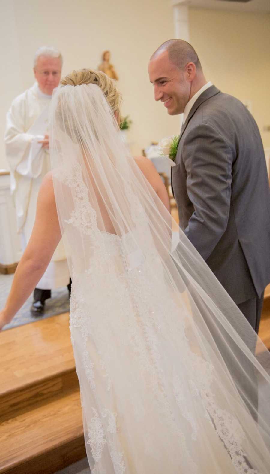 husband and wife stand together on their wedding day