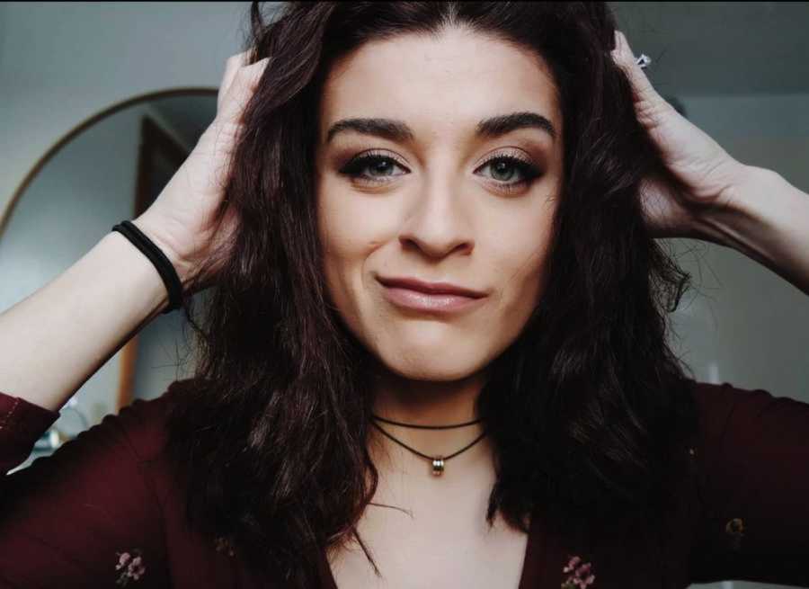 woman in red shirt scrunches hair